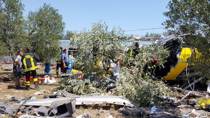 epa05421612 A handout picture provided by the Italian Fire Brigade on 12 July 2016 shows emergency services working at the crash site where two trains collided on a single-track stretch between Ruvo di Puglia and Corato, southern Italy, 12 July 2016. A least ten people have been killed and dozens injured according to reports. EPA/ITALIAN FIRE BRIGADE / HANDOUT HANDOUT EDITORIAL USE ONLY/NO SALES HANDOUT EDITORIAL USE ONLY/NO SALES