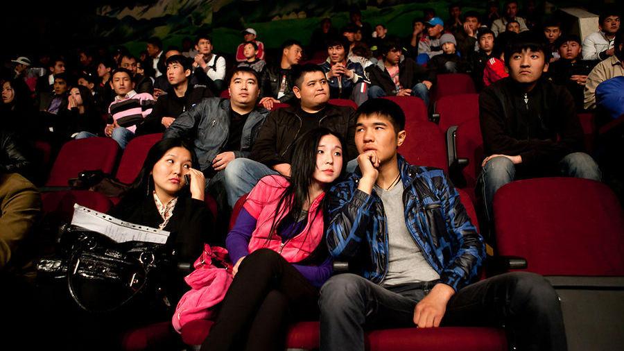Young people watching a wrestling match, Bishkek, April 2011. David Trilling
